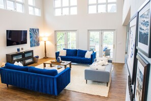 Living area on second floor next to kitchen.