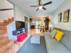 The unit has an open concept main floor has a comfortable living space, dining area, half bath, full kitchen and screened back terrace with laundry and gas BBQ.