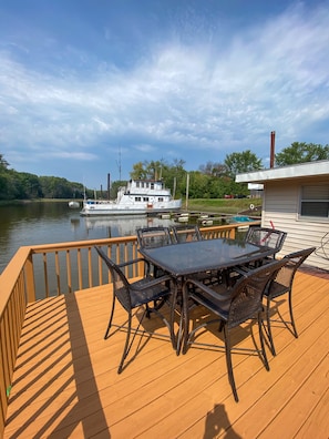 private outdoor deck with a high top table for 6 people