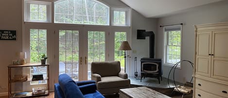 Spacious family room overlooking wooded lot.  DirecTV in chest.