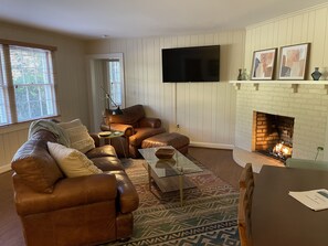 Living room with smart tv and easy control gas fireplace 