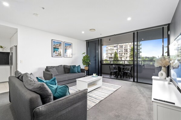 Spacious living room area just right next to the balcony