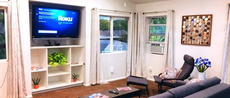 "Living Room(1)". To the left, there is a door that leads out to the back deck