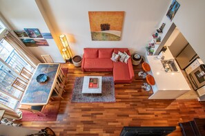 View of the spacious living and dining room from the master bedroom loft.