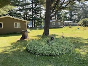 Sams Place Lawn and 3 cabins along lake, cabin 2 is the middle one.