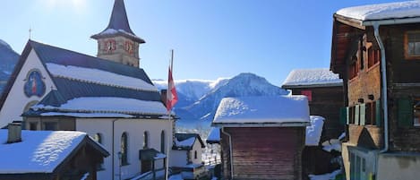 Sky, Property, Snow, Building, Window, Mountain, Freezing, Slope, Cloud, Glacial Landform