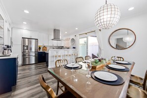 Kitchen table seats 8.  Sit and eat while chatting with anyone.