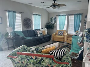 Living room with two chairs that fold out to twin beds