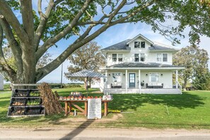 House exterior with seasonal farm stand 