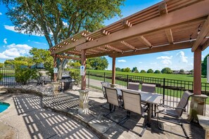 Backyard with heated pool, spa, grill, patio and outdoor dining.