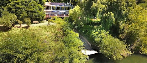 Rear of home facing the Russian River with stairs leading to seasonal dock. 