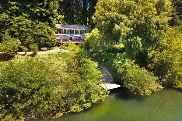 Rear of home facing the Russian River with stairs leading to seasonal dock. 