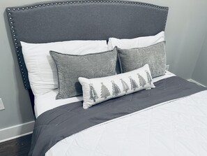 Queen size bed with plush pillows 