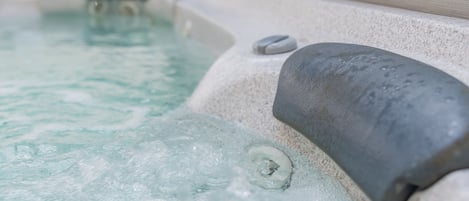 Relax in the hot tub off the back deck