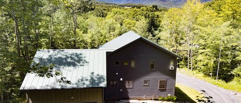 View of the property from the back - looking at the green mountains/ sugarbush