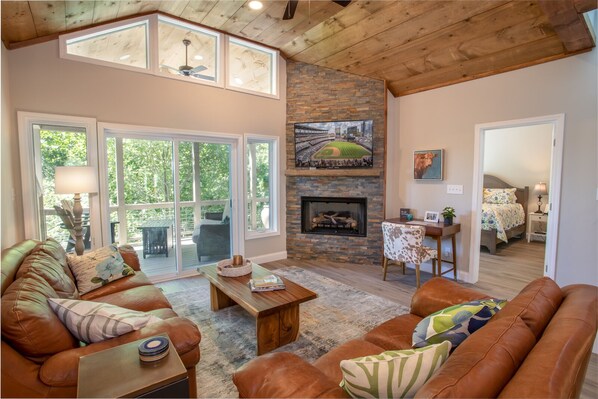 Living room looking out to covered deck living space