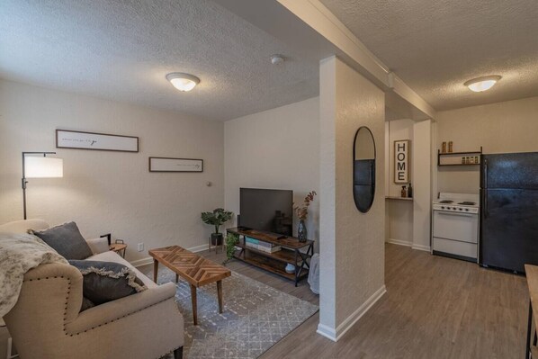 First step in the door to the foyer & offside living room.