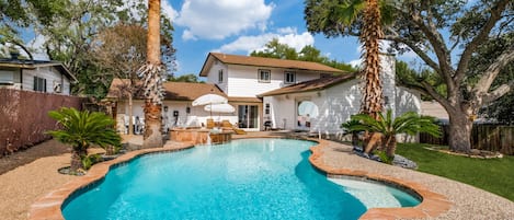 This amazing pool is heated by a 450,000 BTU gas heater! Don't want to wait for the pool? Crank the hot tub and relax in this backyard paradise no matter the season