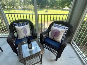 Golf course view from screened porch, overlooking Maples hole #9