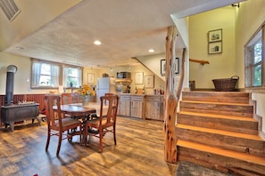 Open concept living space with stairs up to the sleeping area