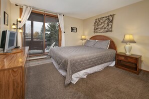 Master bedroom with queen bed and private bathroom.