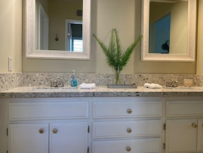 Primary bathroom double vanity with new quartz countertops