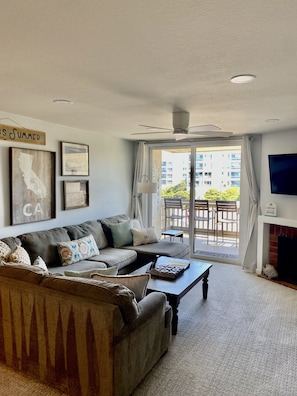 Spacious Living Room Recessed Lighting and Gas Fireplace