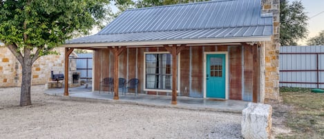 Front view of Cabin #1.  Long patio to hang out and relax.