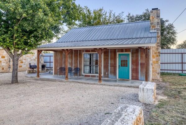 Front view of Cabin #1.  Long patio to hang out and relax.