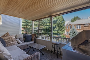 Enjoy a glass of wine or morning cup of coffee on the covered balcony.