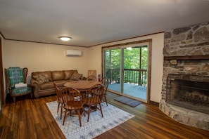 Lower Level Family Room with Leather (sleeper) Sofa, Stone Wood Burning Fireplace, and HD Smart TV (not pictured)