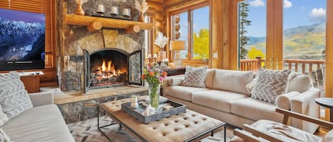 Main Level - Living area with a spectacular fireplace, and magnificent views. The entire home is newly re-decorated in a contemporary mountain style.