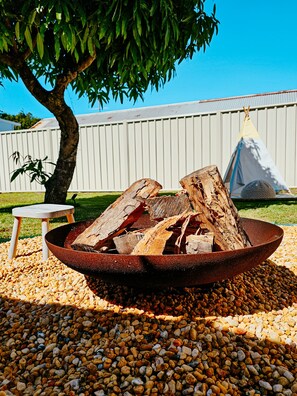 In the evening, gather the group around the firepit to make memories.