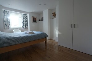 Bedroom with king size ben and large wardrobe