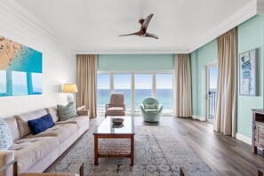 Step into this serene and sunlit living room, where panoramic Gulf views steal the show. The large picture windows frame the sparkling emerald waters, creating a stunning backdrop for relaxation and conversation.