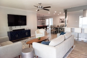 Comfortable gathering with TV, Music, Pool, Kitchen and game room.