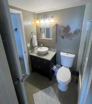 Shared upstairs bathroom includes tub/shower combination