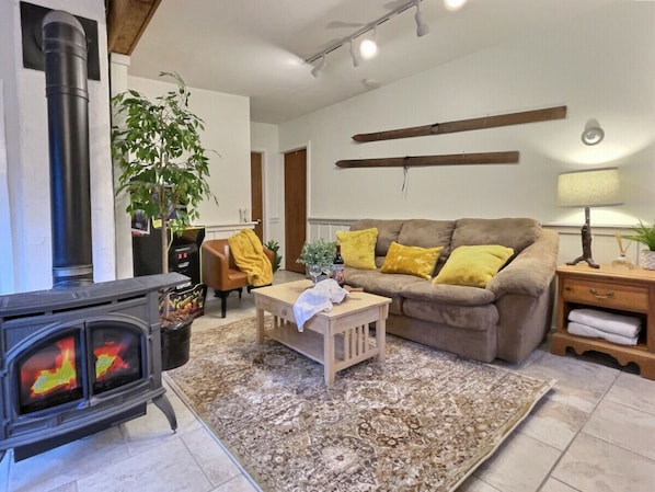 Gather 'round the warmth of the hearth, where every flame dances to the rhythm of shared moments and cozy comforts. Our living room with a fireplace is the heart of home