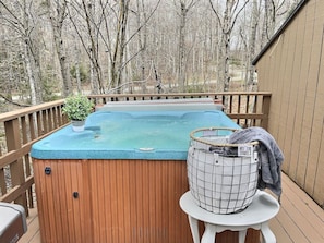 Relax in our mountain hot tub, where stunning views meet ultimate comfort. Towels provided for your convenience.