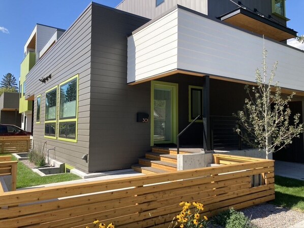 Front door, small deck, small patio. 