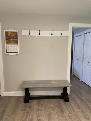 Comfortable bench to take off shoes as you enter.