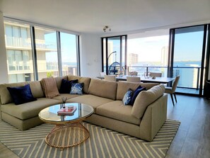 Dual sliding doors open up to the large expansive terrace with bay views