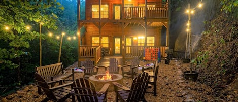 Stunning backyard with incredible lights, firepit, bbq, games, deck & swing!