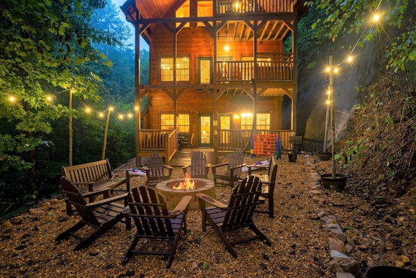 Stunning backyard with incredible lights, firepit, bbq, games, deck & swing!