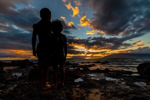 I captured a beautiful moment between my son and daughter as the sun began to set at Kamaole Beach Park II. Create your own unforgettable memories here.