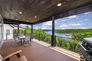 Huge deck off the Main Level living room with a beautiful view of the lake
