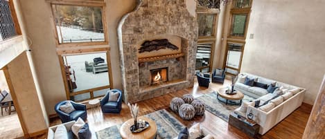 Living Room: "Modern design with cozy fireplace and abundant natural light."