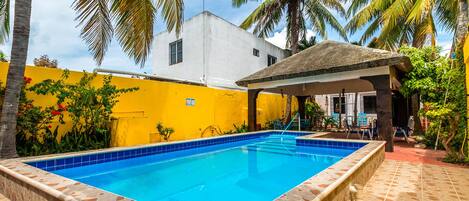 The courtyard pool with mature palm trees & lush native vegetation.