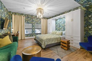 Jungle Suite on the intimate mezzanine level that overlooks the building's colonnade on Sunrise Avenue. Blackout curtains for privacy.