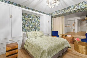 The sleeping and living area can be separated from the dining and kitchen area with blackout curtains.